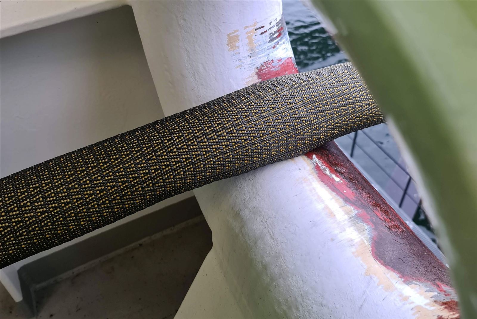 CPRO Mooring H&L sleeve protecting a mooring line where it crosses a painted steel edge on a vessel