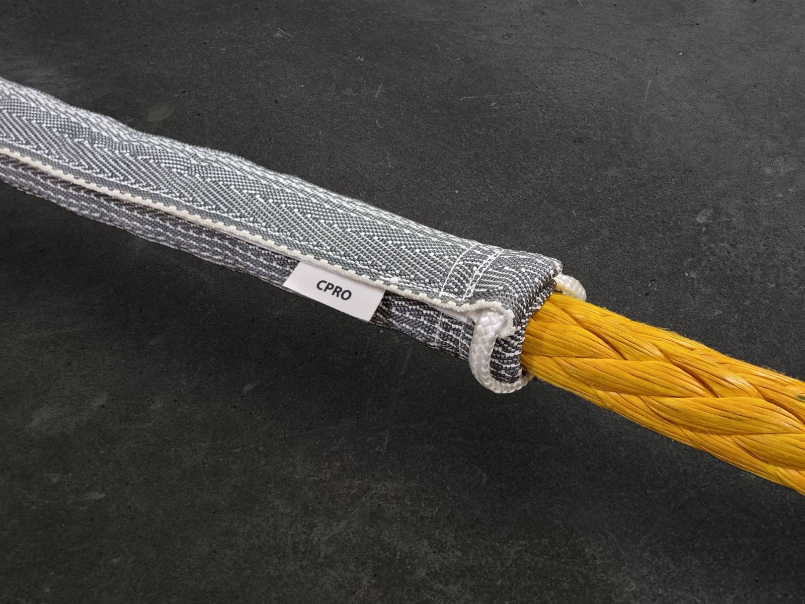 CPRO Pure H&L sleeve fitted over the eye splice of a yellow twelve-strand synthetic rope